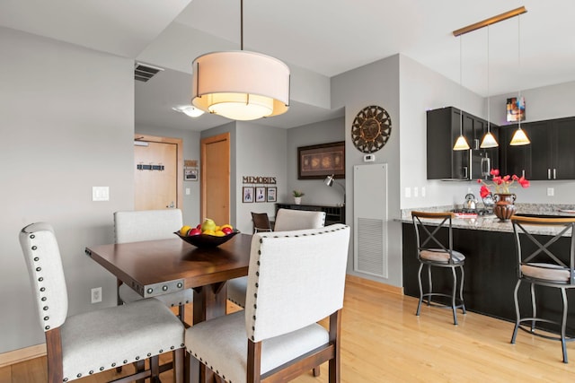 215 10th Ave S Unit 730, Minneapolis, MN 55415 - dining area featuring light wood-style flooring