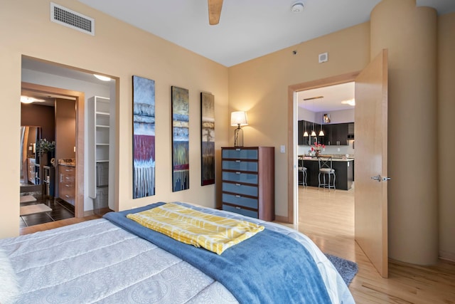 215 10th Ave S Unit 730, Minneapolis, MN 55415 - bedroom with light wood finished floors and a ceiling fan