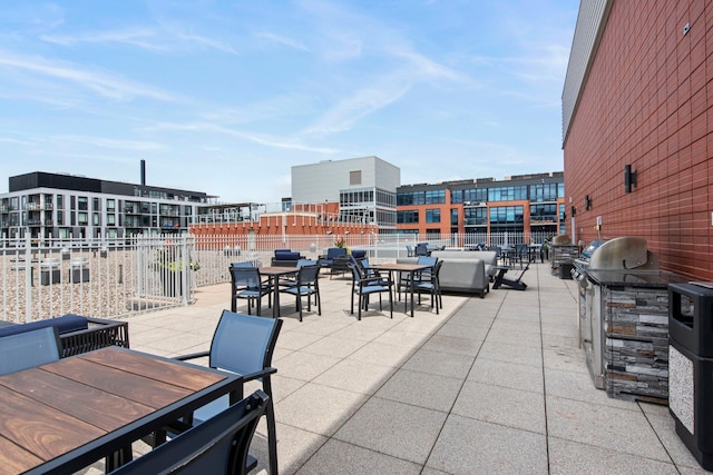 215 10th Ave S Unit 730, Minneapolis, MN 55415 - view of patio / terrace featuring outdoor dining area and an outdoor kitchen