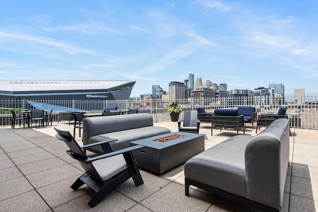 215 10th Ave S Unit 730, Minneapolis, MN 55415 - view of patio featuring an outdoor living space with a fire pit and a skyline view