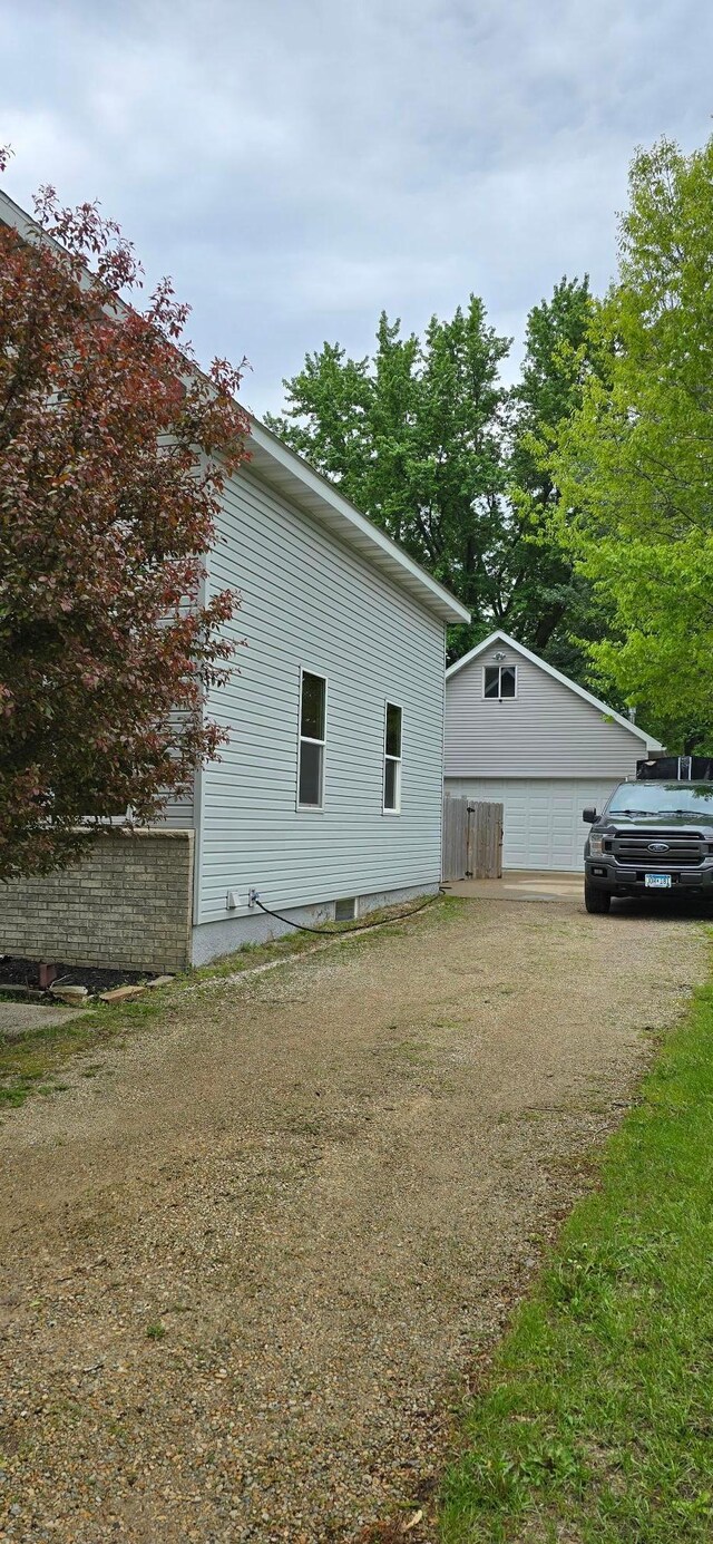 526 Mound St, Owatonna, MN 55060 - view of side of property with a garage and an outbuilding
