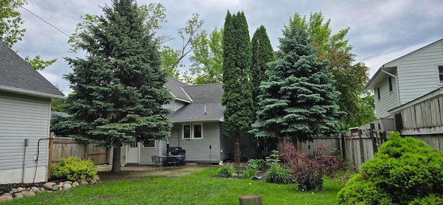 526 Mound St, Owatonna, MN 55060 - back of house featuring a patio area and roof with shingles