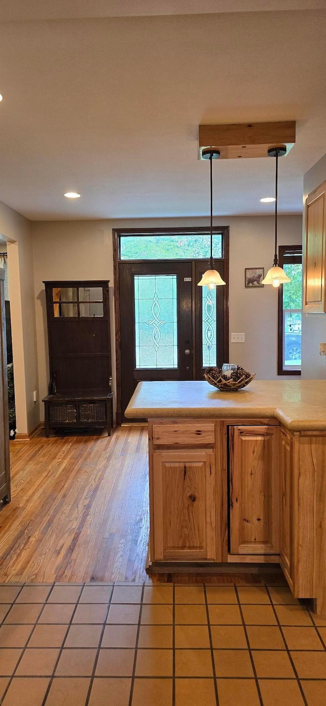 526 Mound St, Owatonna, MN 55060 - kitchen featuring light countertops, hanging light fixtures, recessed lighting, and light tile patterned floors