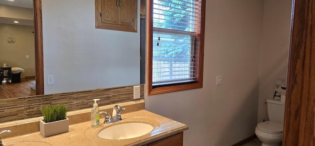 526 Mound St, Owatonna, MN 55060 - bathroom featuring double vanity and decorative backsplash