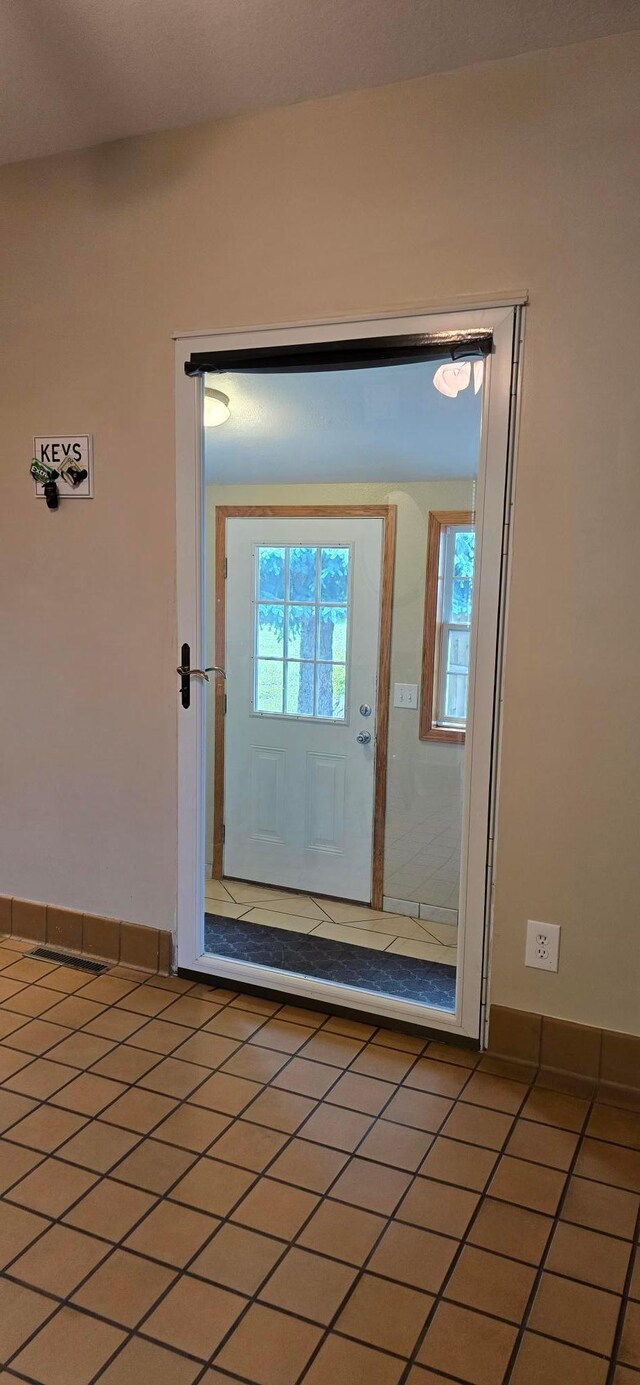526 Mound St, Owatonna, MN 55060 - doorway to outside with light tile patterned floors