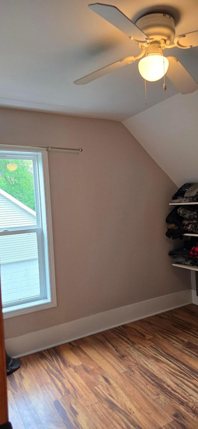 526 Mound St, Owatonna, MN 55060 - bonus room with wood finished floors, ceiling fan, and vaulted ceiling