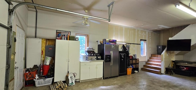 526 Mound St, Owatonna, MN 55060 - garage featuring stainless steel fridge and ceiling fan