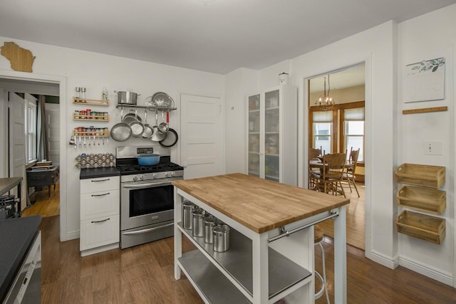 1023 Avon St N, Saint Paul, MN 55103 - kitchen featuring gas range, butcher block counters, open shelves, and a chandelier
