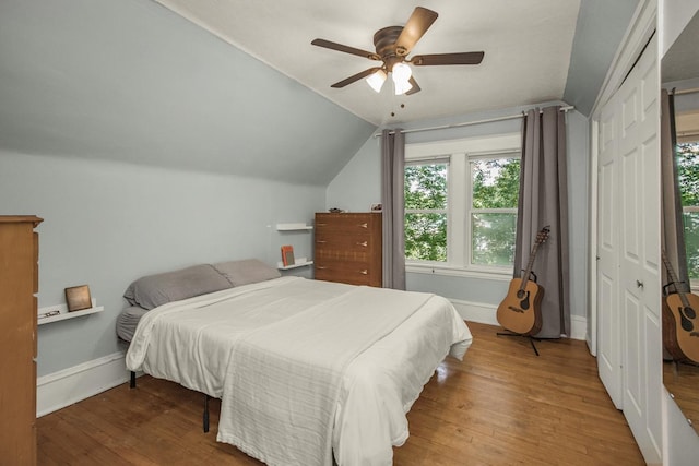 1023 Avon St N, Saint Paul, MN 55103 - bedroom with wood finished floors, vaulted ceiling, and a ceiling fan