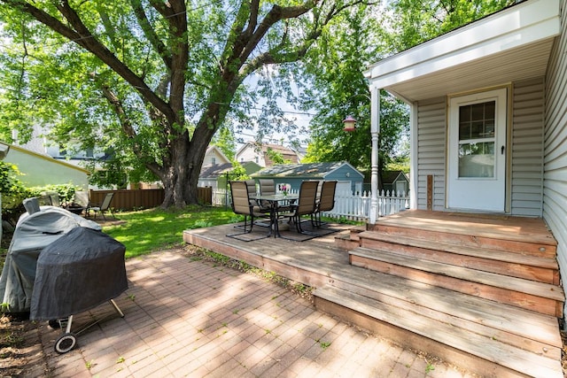 1023 Avon St N, Saint Paul, MN 55103 - deck with outdoor dining area and a fenced backyard