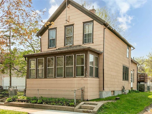 587 Bay St, Saint Paul, MN 55102 - view of side of home featuring a chimney