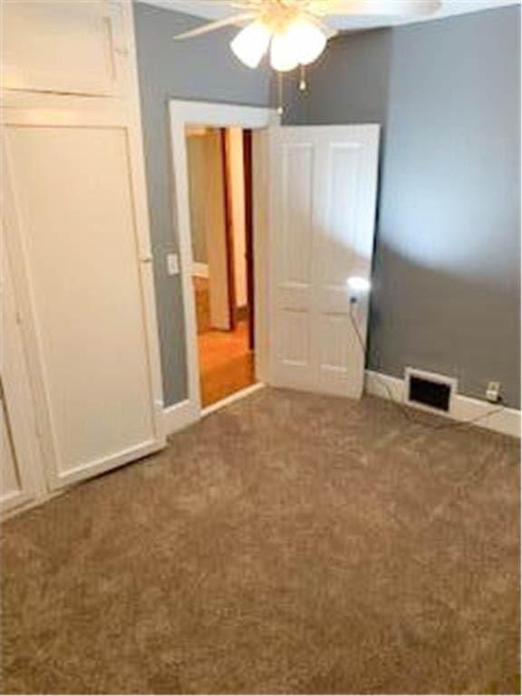 587 Bay St, Saint Paul, MN 55102 - unfurnished bedroom with carpet and a ceiling fan
