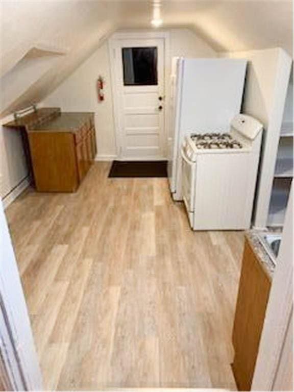 587 Bay St, Saint Paul, MN 55102 - additional living space with light wood finished floors and lofted ceiling