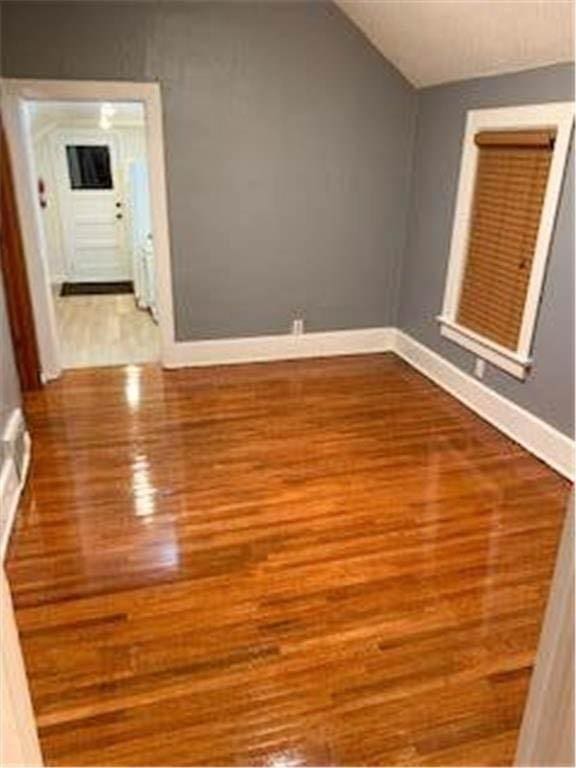 587 Bay St, Saint Paul, MN 55102 - additional living space featuring wood finished floors and lofted ceiling