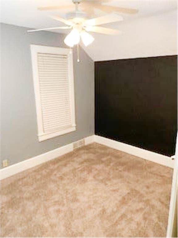 587 Bay St, Saint Paul, MN 55102 - carpeted spare room featuring a ceiling fan and baseboards