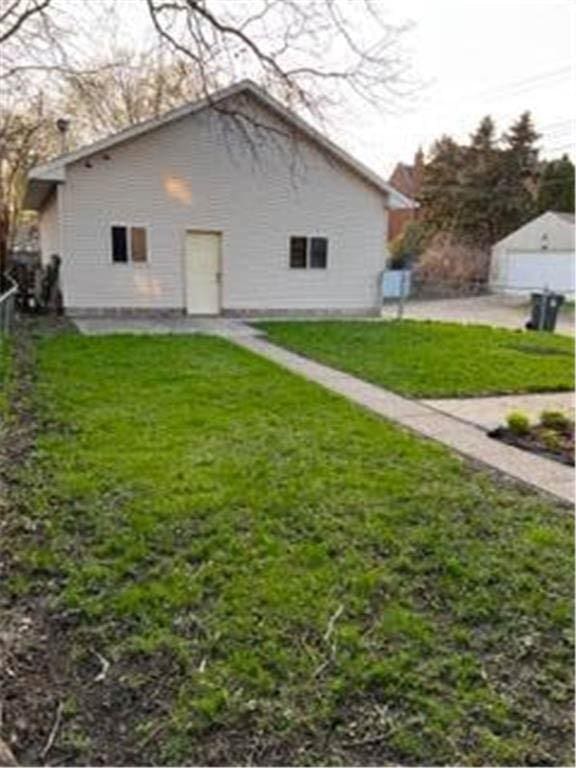587 Bay St, Saint Paul, MN 55102 - back of house with a yard