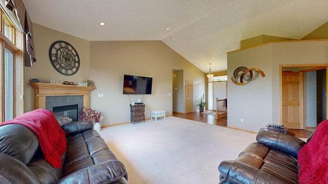 4374 Shetland Pl NW, Rochester, MN 55901 - living room with vaulted ceiling, baseboards, carpet floors, and a fireplace