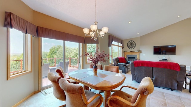 4374 Shetland Pl NW, Rochester, MN 55901 - dining space featuring a chandelier, lofted ceiling, a glass covered fireplace, recessed lighting, and baseboards