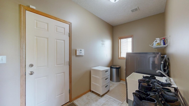 4374 Shetland Pl NW, Rochester, MN 55901 - laundry area featuring baseboards and a textured ceiling