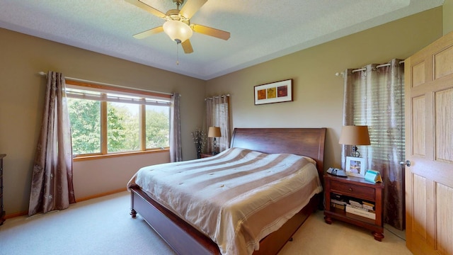 4374 Shetland Pl NW, Rochester, MN 55901 - bedroom featuring light carpet, baseboards, and ceiling fan