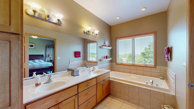 4374 Shetland Pl NW, Rochester, MN 55901 - bathroom with tile patterned floors, a bath, ensuite bath, and double vanity