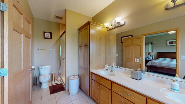 4374 Shetland Pl NW, Rochester, MN 55901 - ensuite bathroom with toilet, double vanity, a shower stall, and tile patterned floors