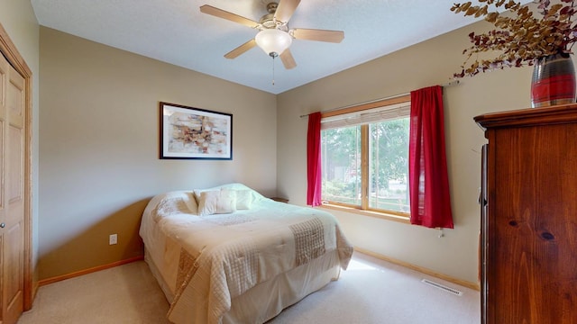 4374 Shetland Pl NW, Rochester, MN 55901 - bedroom with baseboards, light colored carpet, and a ceiling fan