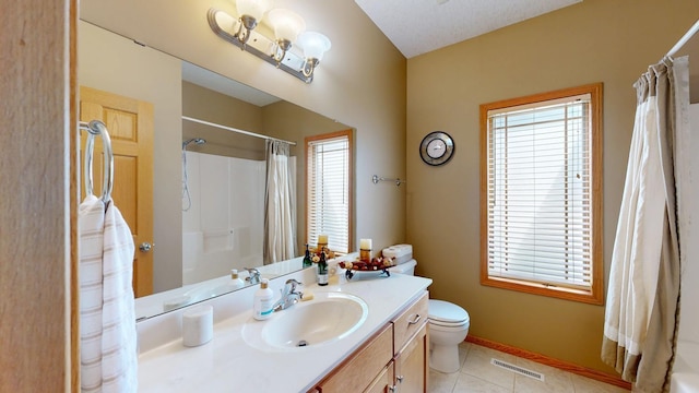 4374 Shetland Pl NW, Rochester, MN 55901 - bathroom featuring vanity, toilet, plenty of natural light, and tile patterned floors