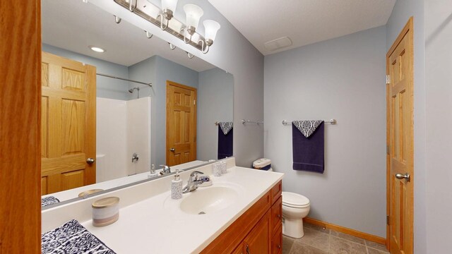 4374 Shetland Pl NW, Rochester, MN 55901 - full bath with vanity, toilet, baseboards, and a shower