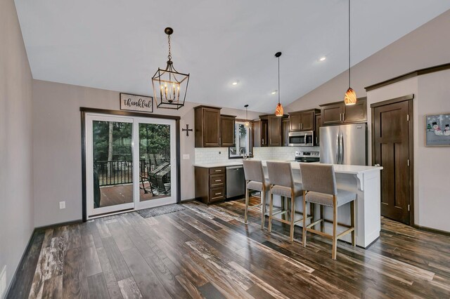 155 Juno Ct, Watab Twp, MN 56367 - kitchen with appliances with stainless steel finishes, dark brown cabinets, dark wood-style floors, light countertops, and vaulted ceiling