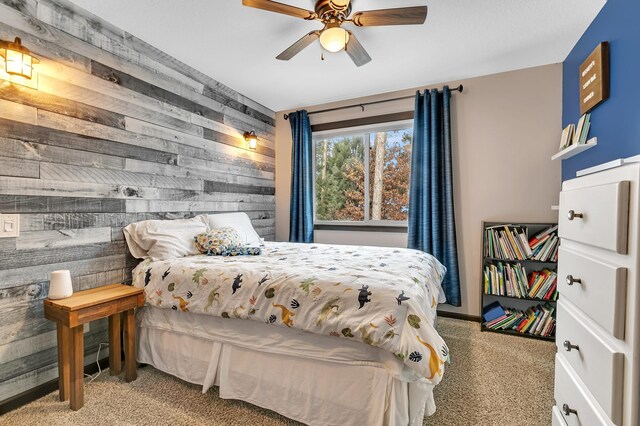 155 Juno Ct, Watab Twp, MN 56367 - bedroom featuring light carpet, wood walls, and ceiling fan