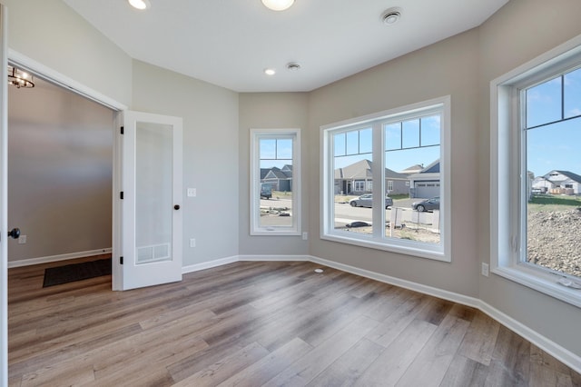 15354 112th Ave N, Dayton, MN 55369 - spare room with wood finished floors, plenty of natural light, baseboards, and recessed lighting