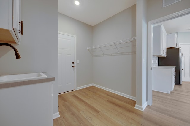 15354 112th Ave N, Dayton, MN 55369 - washroom with a sink, light wood-style floors, baseboards, and recessed lighting