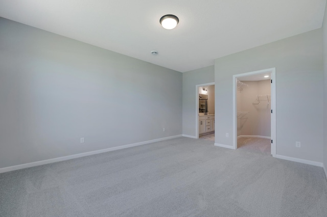 15354 112th Ave N, Dayton, MN 55369 - unfurnished bedroom with a spacious closet, light colored carpet, baseboards, and a closet