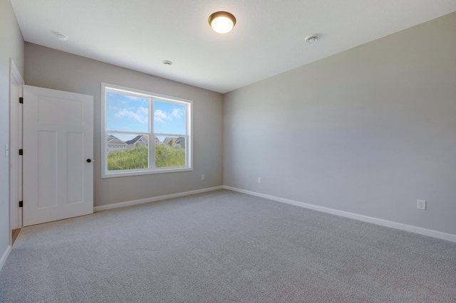 15354 112th Ave N, Dayton, MN 55369 - unfurnished room featuring baseboards, light colored carpet, and a smoke detector