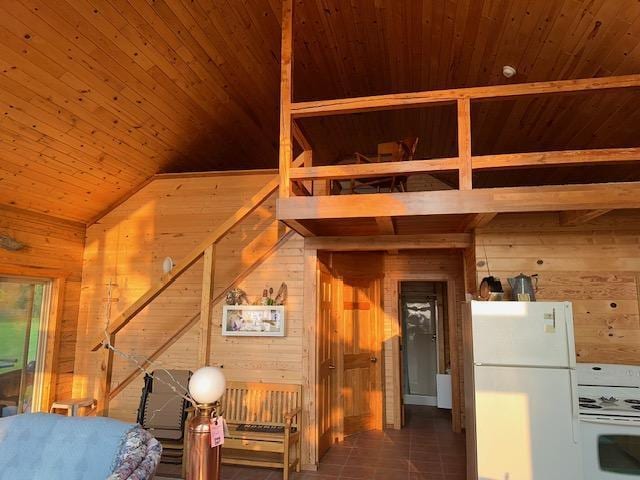 19373 Ethel Beach Rd NE, Kelliher, MN 56650 - bonus room featuring wooden walls, wooden ceiling, and tile patterned flooring
