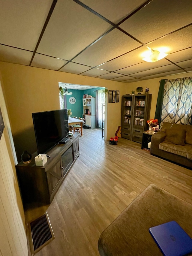 506 3rd St SW, Wadena, MN 56482 - living room featuring a paneled ceiling and wood finished floors