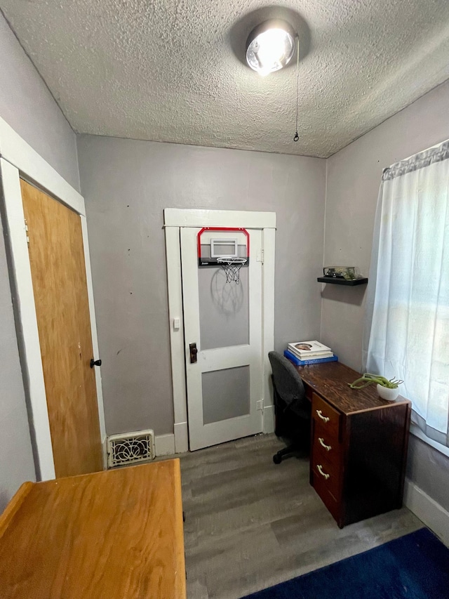 506 3rd St SW, Wadena, MN 56482 - office with wood finished floors and a textured ceiling