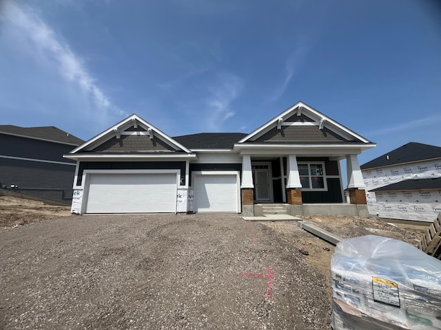 6640 Wolfberry Curv, Minnetrista, MN 55331 - craftsman-style home featuring an attached garage, driveway, and covered porch