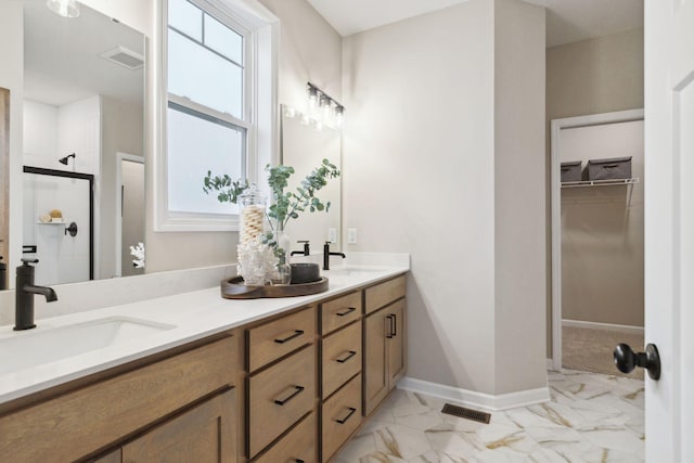 6640 Wolfberry Curv, Minnetrista, MN 55331 - full bath featuring marble look tile flooring, double vanity, a spacious closet, and a stall shower