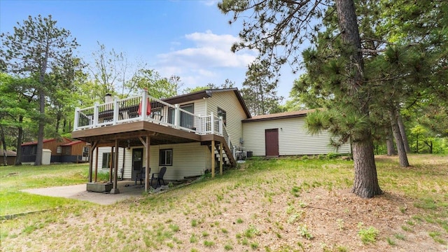 13956 Hardy Lake Rd, Pillager, MN 56473 - rear view of property with a wooden deck, stairs, a lawn, a patio, and central AC
