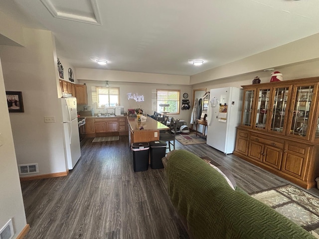 420 14th St, Brainerd, MN 56401 - dining area with dark wood-style flooring and baseboards