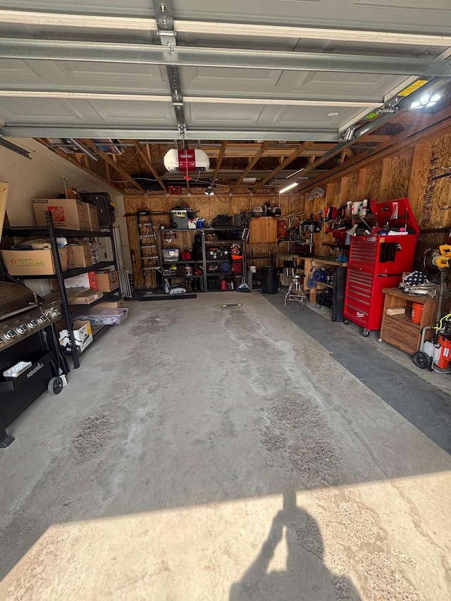 420 14th St, Brainerd, MN 56401 - garage featuring a workshop area and a garage door opener