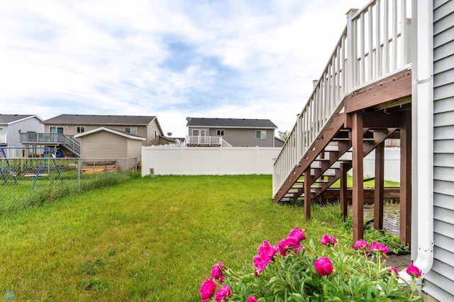 1131 38 1/2 Ave W, West Fargo, ND 58078 - fenced backyard with stairs and a residential view
