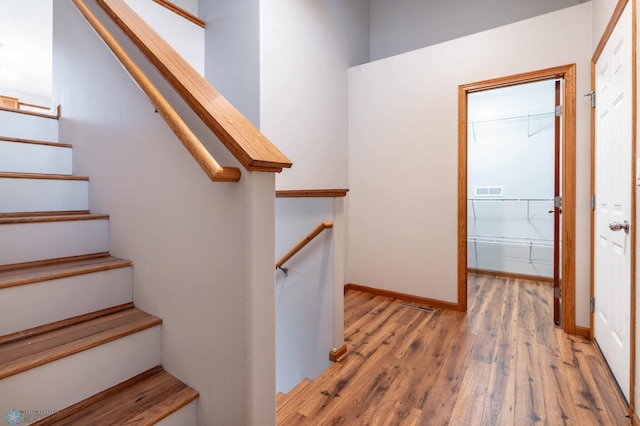 1131 38 1/2 Ave W, West Fargo, ND 58078 - staircase featuring hardwood / wood-style flooring and baseboards