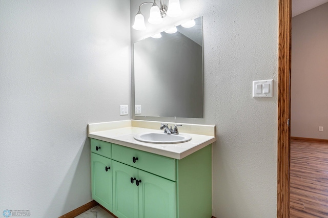 1131 38 1/2 Ave W, West Fargo, ND 58078 - bathroom featuring vanity and a chandelier