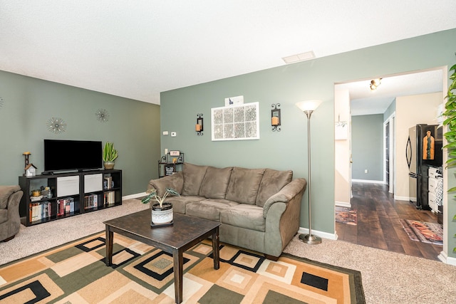 12233 191st Ave NW, Elk River, MN 55330 - carpeted living room featuring baseboards
