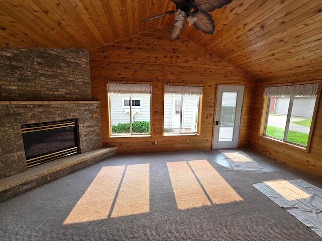 415 9th St N, Cannon Falls, MN 55009 - unfurnished living room with vaulted ceiling, plenty of natural light, a ceiling fan, wooden walls, and wooden ceiling