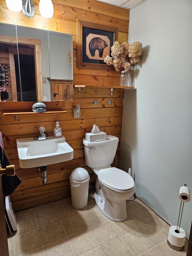 37791 Mallard Loop, Edna Twp, MN 56573 - bathroom featuring tile patterned floors and wood walls