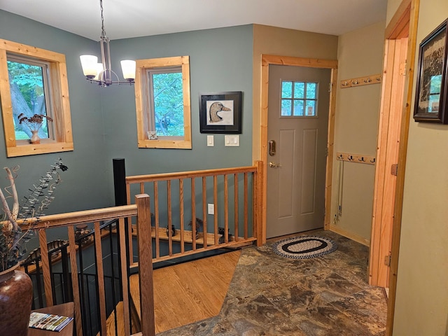 37791 Mallard Loop, Edna Twp, MN 56573 - foyer with a chandelier, plenty of natural light, and wood finished floors